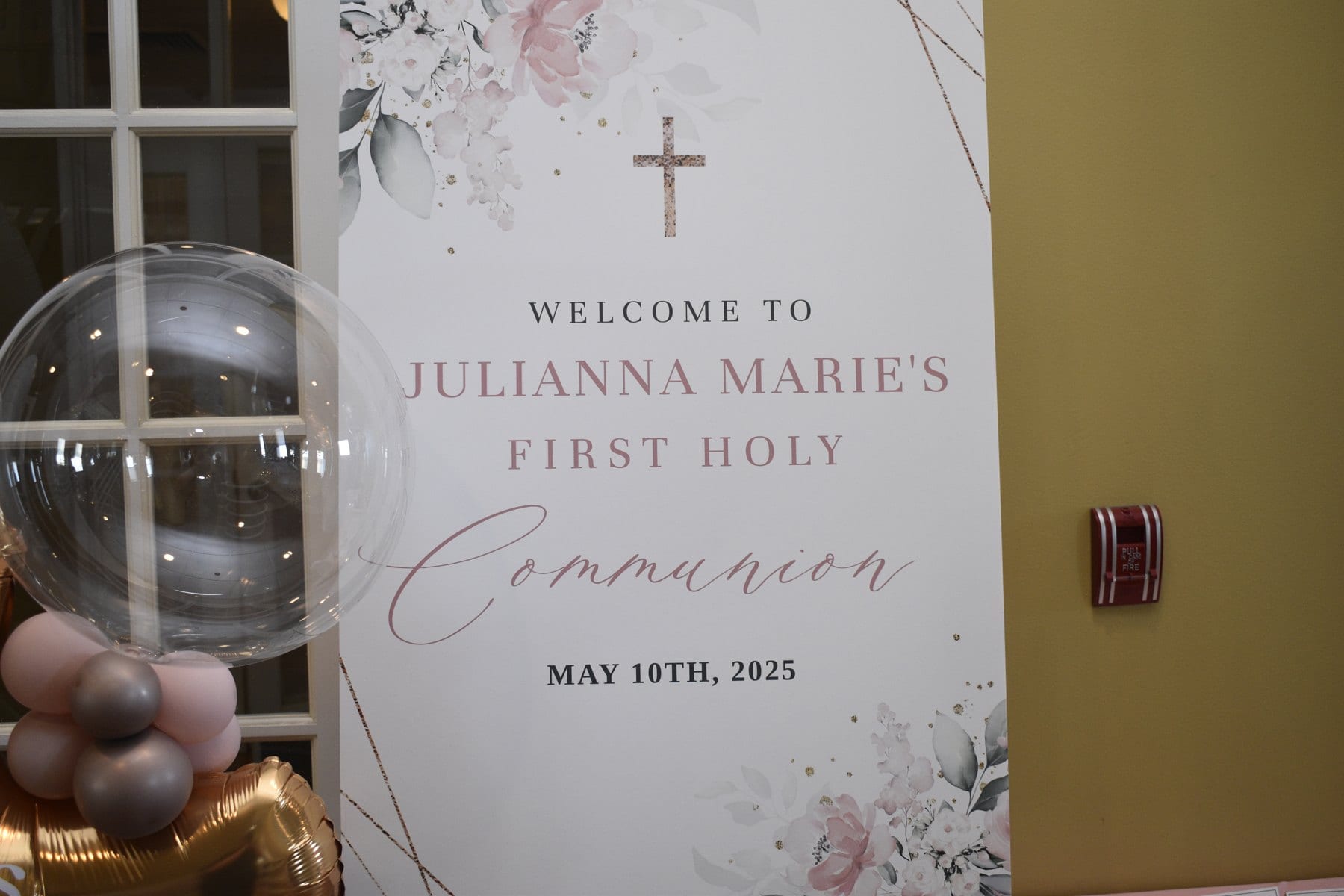 Welcome sign and floral details at a private celebration