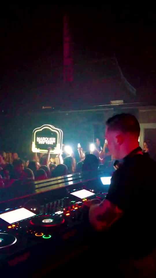 DJ performing to a packed room at Marquee New York
