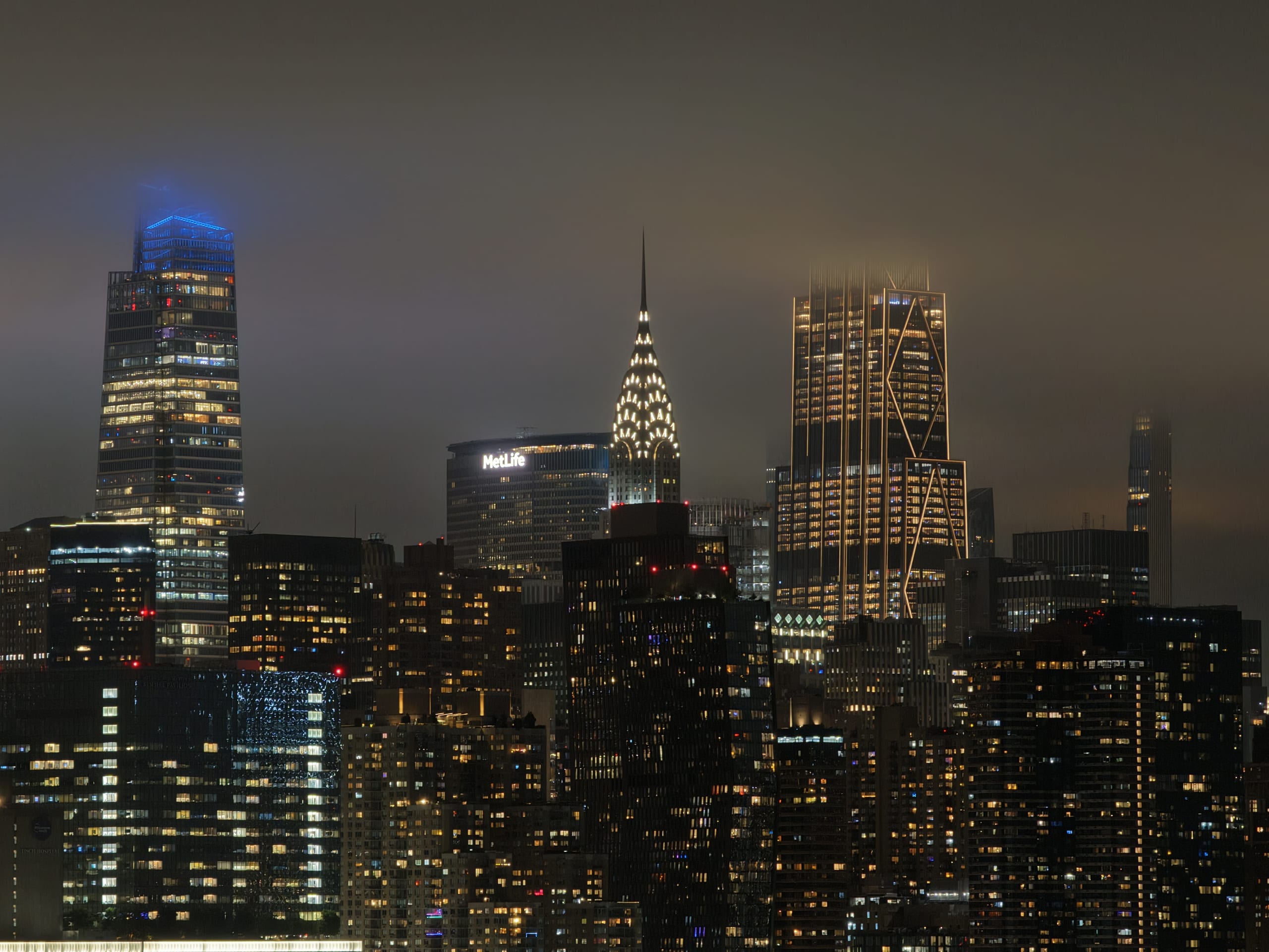 Manhattan skyline at night with the Chrysler Building illuminated