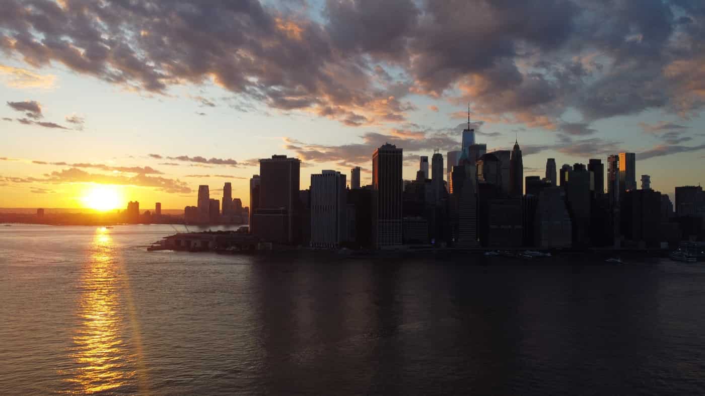 Lower Manhattan skyline at sunset from the water